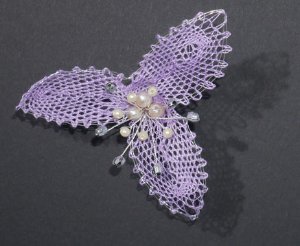 Fleur simple mauve en grille